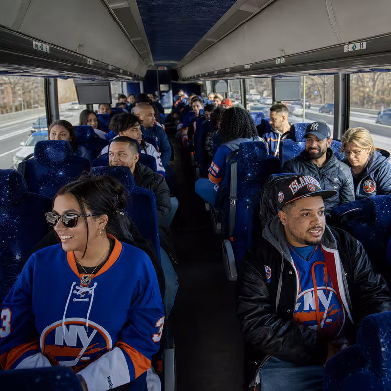 Passenger seating aboard a Queens party bus rental