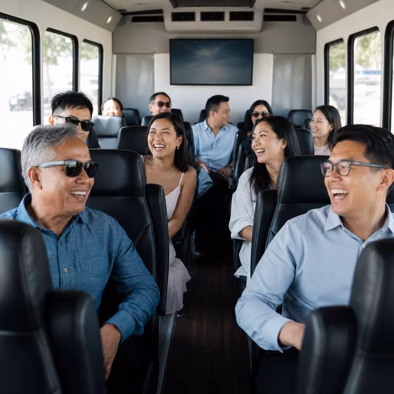 Group boarding a white charter bus for Private Event Transportation transportation in Queens