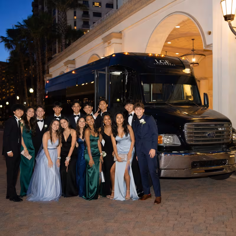Party bus interior with wraparound leather seating and LED lighting in Queens